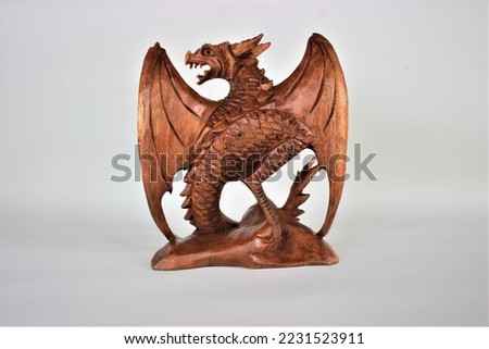 	
Wooden Dragon Sculpture Handmade Bali Wood Carving, Sculpture, Art from Bali Indonesia Royalty-Free Stock Photo #2231523911