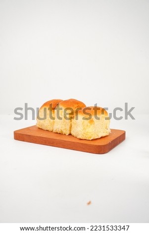 Roti Sobek or Torn Bread with board isolated on a white background. Royalty-Free Stock Photo #2231533347