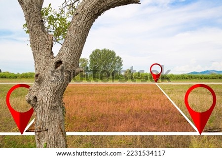 Land plot management - real estate concept with a vacant land and cadastral parcel available for building construction in a rural scene with tree Royalty-Free Stock Photo #2231534117