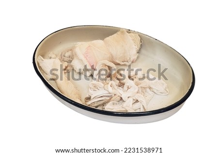 Vintage iron medical tray with bandages from the First World War, isolated on a white background