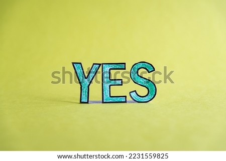 The word yes on yellow background  