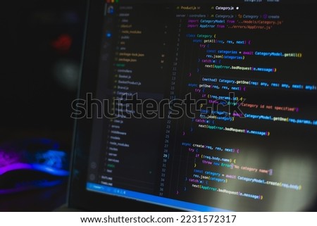 Programming language on black screen background, Javascript React code Royalty-Free Stock Photo #2231572317