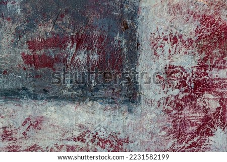 Wall texture painted in red shades. Decorative wall paint. Abstract grunge cracked paint on the wall.