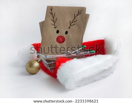 Christmas kraft envelopes with funny deer, idea for decorating gifts for Christmas and Advent calendar,