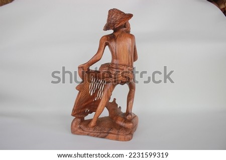 	
Balinese Wooden Fisherman Sculpture Wood Carving, Sculpture, Art from Bali Indonesia Royalty-Free Stock Photo #2231599319