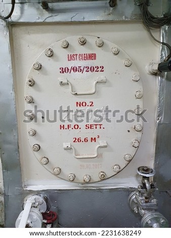 A manhole cover of tanks onboard a cargo ship Royalty-Free Stock Photo #2231638249