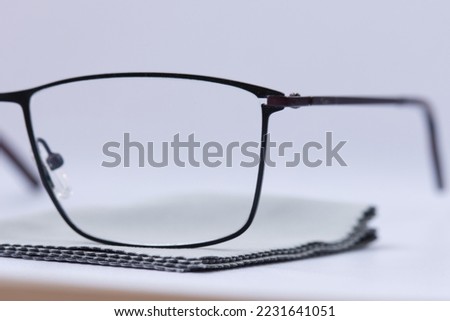 Close up. Concept for cleaning glasses by micro fiber cloth for cleaning lens and glasses concept. Macro close up. 
