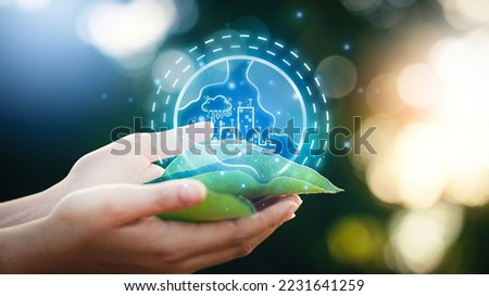 Woman hand holding leaf with smart city icon concept. The environment is of a business connection and sustainable development. renewable energy is environmentally friendly. Technology and new forward. Royalty-Free Stock Photo #2231641259