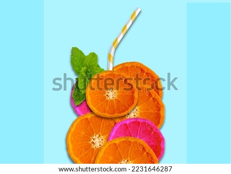 Glass of juice made of citrus fruit slices with mint leaves and a straw on light blue background. Citrus juice concept, Healthy lifestyle concept