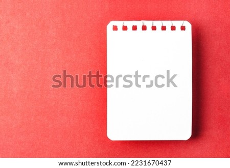 Blank white torn paper on red background for your text or message.
