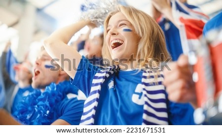 Sport Stadium Big Event: Beautiful Cheering Girl. Crowd of Fans with Painted Faces Cheer, Shout for their Blue Soccer Team to Win. People Celebrate Scoring a Goal, Championship Victory Royalty-Free Stock Photo #2231671531