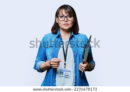 Portrait of woman worker with industrial center card clipboard, on white background