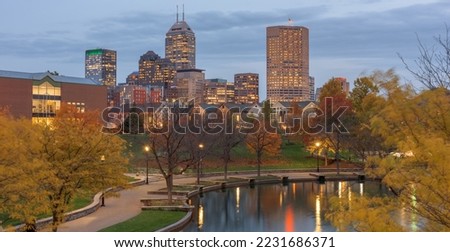 Indianapolis, Indiana, USA river walk and skyline at dusk in the evening.
