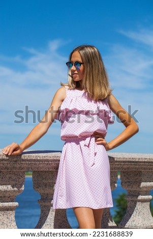 Close up portrait of a young beautiful blonde woman, summer outdoors