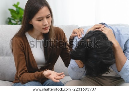 People have a mental illness concept, Wife consoling husband have a depression condition. Royalty-Free Stock Photo #2231693907