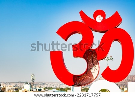 holy om sign board with bright blue sky at morning from flat angle image is taken at ratanada jodhpur rajasthan india on Nov 14 2022.