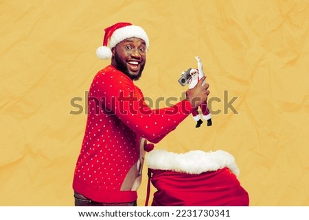 Creative photo 3d collage postcard poster greeting card of afro man hold santa clause figure put inside bag isolated on painting background
