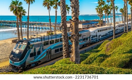 Metro commuter train entering San Clemente Pier Beach Station in Southern California Royalty-Free Stock Photo #2231736701