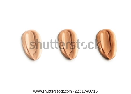 Three different tone liquid makeup foundation stroke on white background. Royalty-Free Stock Photo #2231740715