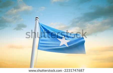 Somalia flag waving in beautiful sky.