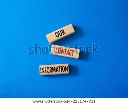 Our contact information symbol. Concept word Our contact information on wooden blocks. Beautiful blue background. Business and Our contact information concept. Copy space