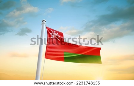 Oman flag waving in beautiful sky.
