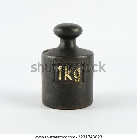 group of four different sized vintage metal scale weights with golden numbers Royalty-Free Stock Photo #2231748823