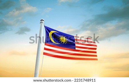 Malaysia flag waving in beautiful sky.