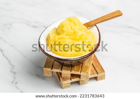 Homemade Melted ghee clarified butter. Bio Ayurveda Lactose free high quality butter on a light background. place for text, top view. Royalty-Free Stock Photo #2231783643