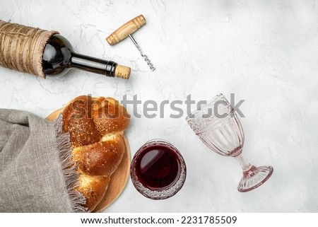 Challah bread, shabbat wine, Traditional Jewish Shabbat ritual. Shabbat or Shabath concept. Long banner format. top view, Royalty-Free Stock Photo #2231785509