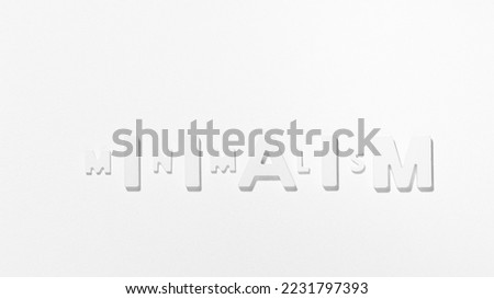 Minimalism - Single word among white empy space. Black and white photography Royalty-Free Stock Photo #2231797393