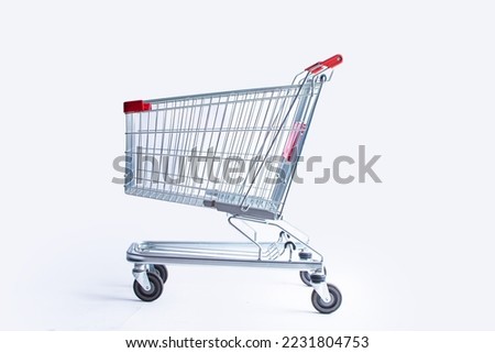 shopping cart side view trolley red colour on white background | E-commerce supermarket trolley side view Royalty-Free Stock Photo #2231804753