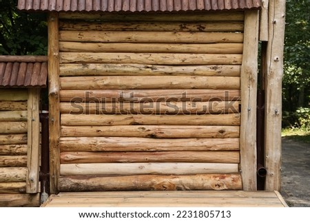 Log Cabin Or Barn Unpainted Debarked Wall Textured Horizontal Background With Copy Space. Royalty-Free Stock Photo #2231805713