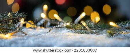 christmas string lights in snow