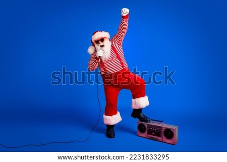 Full length body size view of his he handsome bearded fat overweight cheerful Santa vocalist star singing hit having fun rest leisure isolated bright vivid shine vibrant red color background