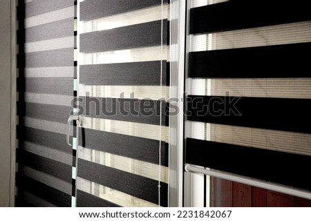 Window roller duo system day and night. Close up on roll curtains indoor Royalty-Free Stock Photo #2231842067