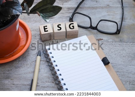 Selective focus on the word ESG on the wooden blocks.  Education on ESG concept.