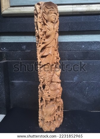 Kwan im Wooden Statue Handmade Bali Wood Carving, Sculpture, Art from Bali Indonesia Royalty-Free Stock Photo #2231852965