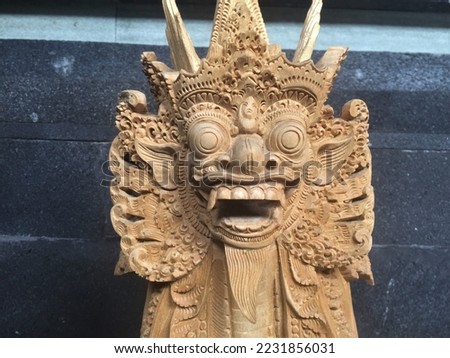 Balinese Handmade Barong Wooden Sculpture Wood Carving, Sculpture, Art from Bali Indonesia Royalty-Free Stock Photo #2231856031