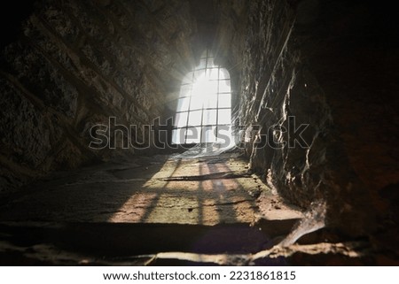 An ancient European chapel lit by ray of sunlight