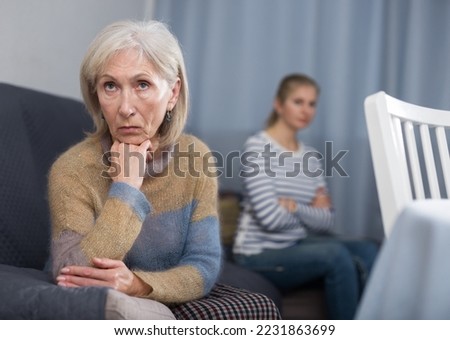 Portrait of a mature woman who took offense at her adult daughter after a quarrel