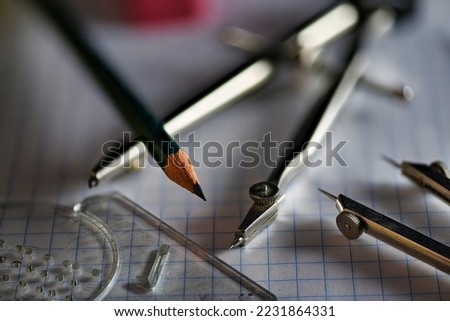 Drafting Tools on Grid Paper close up