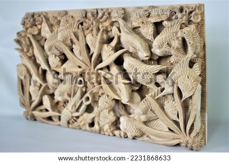 Balinese Wooden Fish Sea Life Carving Wood Carving, Sculpture, Art from Bali Indonesia Royalty-Free Stock Photo #2231868633