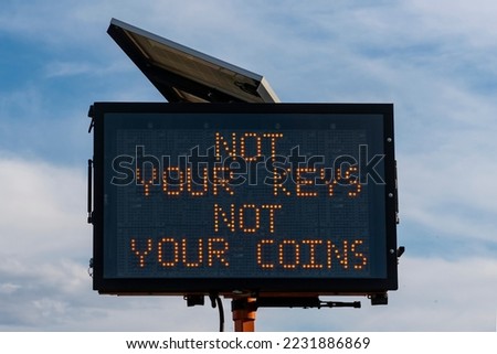 Photo illustration of digital road sign with text Not Your Keys Not Your Coins expressing cryptocurrency concept of self custody of digital assets and their associated private keys or passphrase  Royalty-Free Stock Photo #2231886869