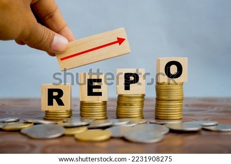 REPO repurchasing agreement text on wooden cube with red arrow upward Royalty-Free Stock Photo #2231908275