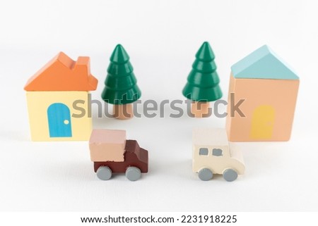 Toy house and truck. image of moving house