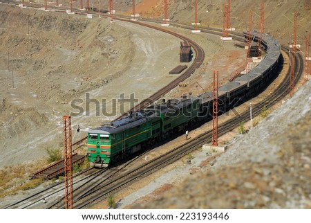 train transports ore from the mine Royalty-Free Stock Photo #223193446