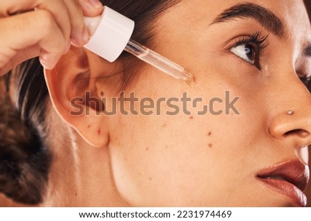 Skincare, facial and woman with beauty, product and skin, wellness and grooming with retinol, serum and collagen. Face, girl and model relax pamper treatment, mask and acne cosmetics, oil and vitamin Royalty-Free Stock Photo #2231974469