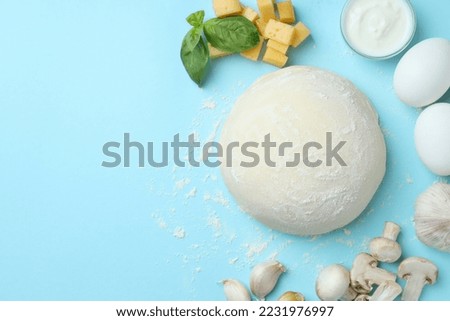 Concept of cooking pizza on blue background