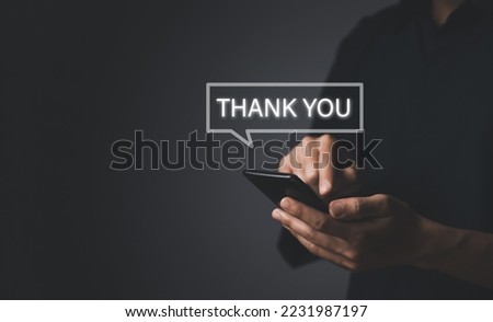 businessman touches the smartphone and sends message words to thank you. Letter writing concept. congratulation, appreciation, and gratitude. with Copy Space